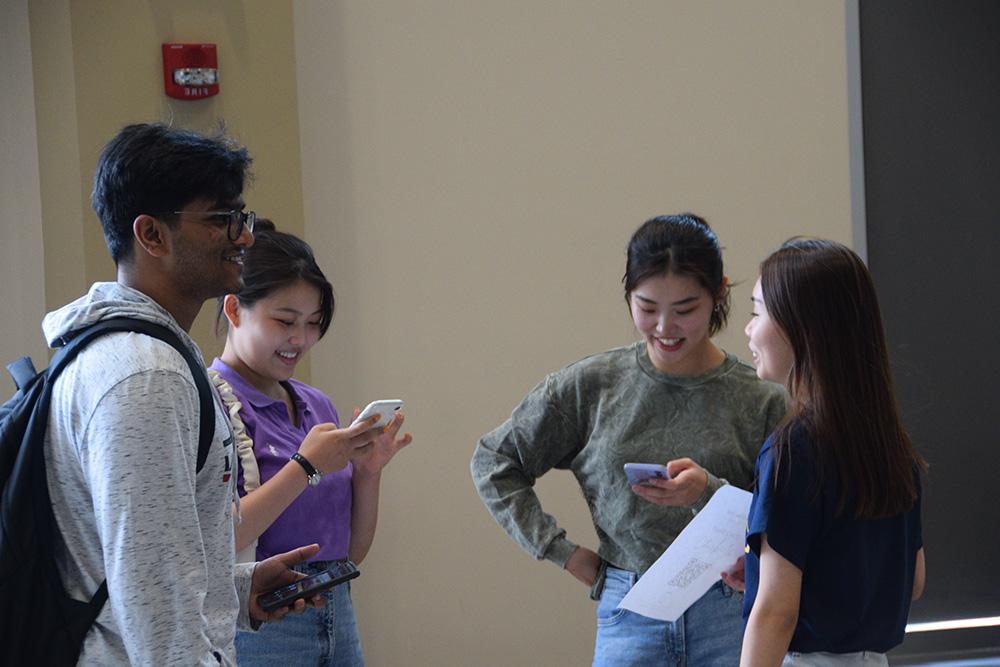 A group of students on their phones